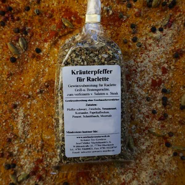 Kräuterpfeffer-Gewürzzubereitung mit dunklen Pfefferkörnern und roten Stücken