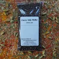 Ganze, dunkle Cherry-Telly-Pfefferkörner